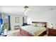 Spacious main bedroom with natural light and a ceiling fan at 1667 Oakland Rd, North Port, FL 34286