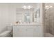 Clean bathroom with a glass-enclosed shower, white cabinetry, and modern fixtures at 17510 Gawthrop Dr # 208, Bradenton, FL 34211