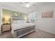 Serene bedroom featuring a plush bed, soft lighting, and stylish decorative accents at 17510 Gawthrop Dr # 208, Bradenton, FL 34211