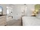 Comfortable bedroom with a view to living area and bathroom, features plush bedding and neutral tones at 17510 Gawthrop Dr # 208, Bradenton, FL 34211