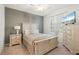 Bright bedroom features a queen bed, stylish furnishings, and neutral wall decor at 17510 Gawthrop Dr # 208, Bradenton, FL 34211