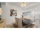 Well-lit dining area with modern furnishings and an open view into the kitchen and living spaces at 17510 Gawthrop Dr # 208, Bradenton, FL 34211