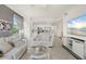 Open-concept living room and kitchen featuring modern finishes and plenty of natural light at 17510 Gawthrop Dr # 208, Bradenton, FL 34211