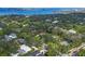 Picturesque aerial view showcasing the home's location amidst lush greenery and a stunning waterfront backdrop at 1773 South Dr, Sarasota, FL 34239