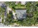 Aerial view of the house with surrounding trees and greenery at 1773 South Dr, Sarasota, FL 34239