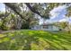 Wide shot of backyard with walkway and view of home at 1773 South Dr, Sarasota, FL 34239