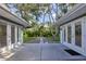 Backyard featuring a stone pathway leading to a bench, surrounded by lush greenery and well-maintained lawns at 1773 South Dr, Sarasota, FL 34239