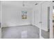 Bright bedroom with Terrazzo floors, neutral walls, window, and ceiling fan at 1773 South Dr, Sarasota, FL 34239