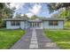 Charming home with walkway, manicured lawn and exterior in great condition at 1773 South Dr, Sarasota, FL 34239