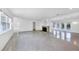 Bright living room with shiny floors, recessed lights, a stone fireplace and access to the outdoors at 1773 South Dr, Sarasota, FL 34239