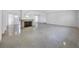Spacious living room featuring polished floors, recessed lighting, and a charming stone fireplace at 1773 South Dr, Sarasota, FL 34239