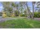 Professionally landscaped yard with shade trees at 1773 South Dr, Sarasota, FL 34239