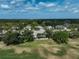 Scenic aerial view of a single Gathering home nestled within lush greenery, creating a private and serene atmosphere at 2111 Muskogee Trl, Nokomis, FL 34275