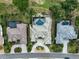 Aerial of home featuring a screened-in pool and lush landscaping, offering the ultimate private oasis at 2111 Muskogee Trl, Nokomis, FL 34275
