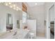 Well-lit bathroom showcasing the vanity, toilet, and glass-enclosed walk-in shower at 2111 Muskogee Trl, Nokomis, FL 34275