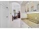 View of the dining room featuring hardwood furniture and a decorative chandelier at 2111 Muskogee Trl, Nokomis, FL 34275