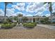 Charming single-story home with mature landscaping on a sunny day at 2111 Muskogee Trl, Nokomis, FL 34275