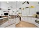 Spacious kitchen with granite countertops, white cabinetry and stainless steel appliances at 2111 Muskogee Trl, Nokomis, FL 34275
