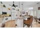 Bright, open kitchen with an island, breakfast bar, white cabinets, and modern appliances at 2111 Muskogee Trl, Nokomis, FL 34275
