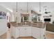 Well-lit kitchen featuring granite countertops, a dishwasher, and a view to the outside at 2111 Muskogee Trl, Nokomis, FL 34275