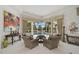 Bright living room features pool view, neutral colors, and elegant decor at 2111 Muskogee Trl, Nokomis, FL 34275
