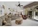 Open-concept living space connects the living room with the kitchen and outdoor patio at 2111 Muskogee Trl, Nokomis, FL 34275