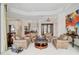 Bright living room featuring elegant decor, large windows, and plenty of space for seating at 2111 Muskogee Trl, Nokomis, FL 34275