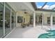 Covered patio area perfect for outdoor dining and relaxation by the pool at 2111 Muskogee Trl, Nokomis, FL 34275