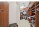 Large walk-in closet providing ample storage space for clothing and accessories at 2111 Muskogee Trl, Nokomis, FL 34275