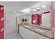 Bathroom featuring granite countertops, double sinks, and a glass-enclosed shower at 2120 Harbourside Dr # 621, Longboat Key, FL 34228