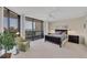 Bright bedroom featuring a balcony, plush carpet, and views of the ocean at 2120 Harbourside Dr # 621, Longboat Key, FL 34228