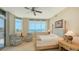 Serene bedroom featuring ocean views, comfortable seating, and a four-poster bed at 2185 Gulf Of Mexico Dr # 243, Longboat Key, FL 34228