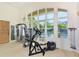 Well-equipped fitness center with state-of-the-art machines, open windows, and mirrored walls for a complete workout experience at 2185 Gulf Of Mexico Dr # 243, Longboat Key, FL 34228