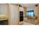 Well-lit kitchen with granite countertops, stainless appliances, and a convenient wine cooler at 2185 Gulf Of Mexico Dr # 243, Longboat Key, FL 34228