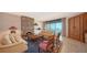 Comfortable living room with a stone fireplace, ocean views, and traditional furnishings at 2185 Gulf Of Mexico Dr # 243, Longboat Key, FL 34228