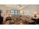 Spacious living room featuring a comfortable leather couch and built-in desk area at 2185 Gulf Of Mexico Dr # 243, Longboat Key, FL 34228