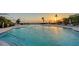 Inviting pool reflecting the sunset offers a serene space for relaxation at 2185 Gulf Of Mexico Dr # 243, Longboat Key, FL 34228