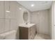 Stylish bathroom with a gray vanity, marble-style tiled walls, and modern lighting at 2319 Beneva Ter # 2284, Sarasota, FL 34232
