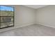 A bright bedroom featuring light tile flooring and a large window with natural light at 2319 Beneva Ter # 2284, Sarasota, FL 34232