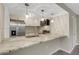 Bright kitchen showcasing stainless steel appliances, spacious counter, white cabinets, and an open layout at 2319 Beneva Ter # 2284, Sarasota, FL 34232