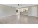 Open concept living room with tile flooring, ceiling fan, and view to the kitchen area at 2319 Beneva Ter # 2284, Sarasota, FL 34232