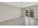 Open living room featuring neutral walls, tile flooring, and large windows with pleasant views at 2319 Beneva Ter # 2284, Sarasota, FL 34232