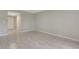 Bright living room featuring tile floors, fresh paint, and access to hallway at 2319 Beneva Ter # 2284, Sarasota, FL 34232