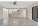 Bright living room with neutral paint, view to kitchen, and large tile floors at 2319 Beneva Ter # 2284, Sarasota, FL 34232