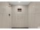 Elegant shower with marble-style tiling, a rainfall showerhead, and a built-in niche at 2319 Beneva Ter # 2284, Sarasota, FL 34232