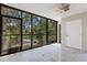 Inviting sunroom with large windows offering scenic views of lush greenery and natural light at 2319 Beneva Ter # 2284, Sarasota, FL 34232