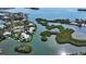 Panoramic aerial view of the property, highlighting its waterfront location and private boat dock at 244 Cedar Park Cir, Sarasota, FL 34242
