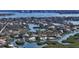 Waterfront property with dock access, luxurious pool, and pristine landscaping nestled in a serene neighborhood at 244 Cedar Park Cir, Sarasota, FL 34242