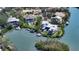 Stunning aerial view of the property, showcasing its waterfront location and private pool area at 244 Cedar Park Cir, Sarasota, FL 34242