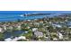 Beautiful waterfront home with a sparkling pool, lush landscaping, and convenient boat dock access at 244 Cedar Park Cir, Sarasota, FL 34242